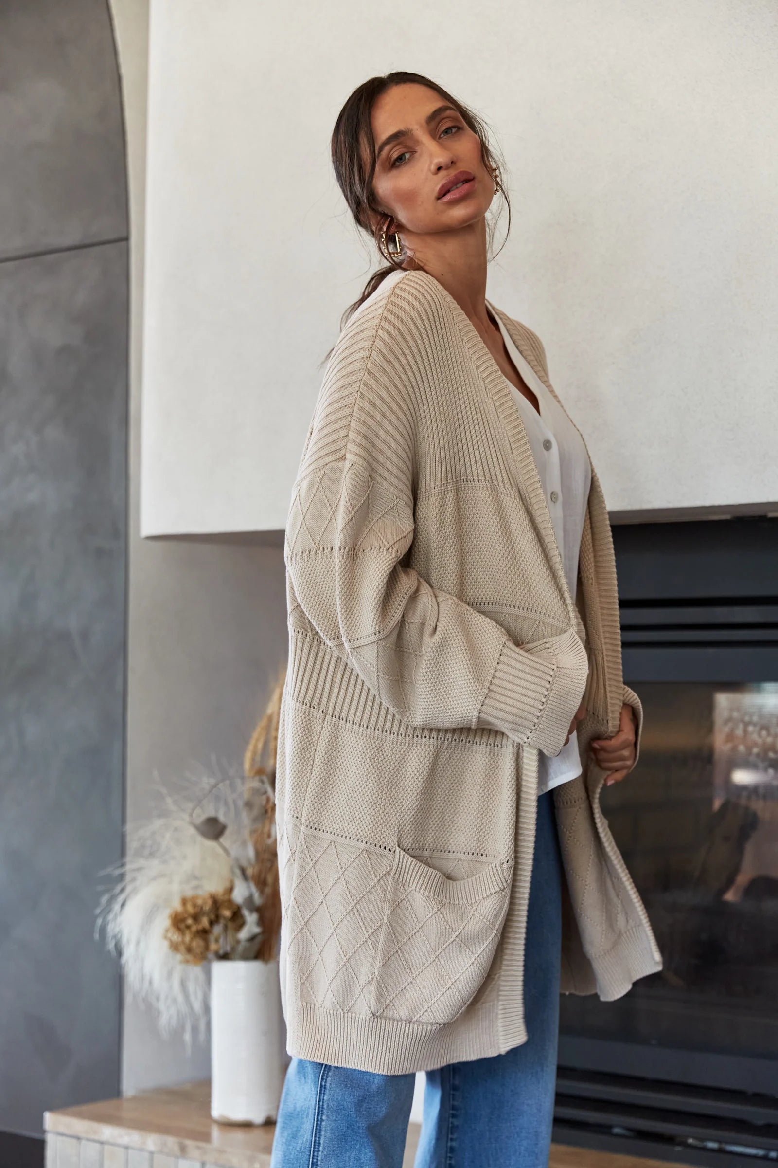 Women's cropped down jackets in bold colors for a sporty and fashionable winter outfitMetro Cardigan - Buff