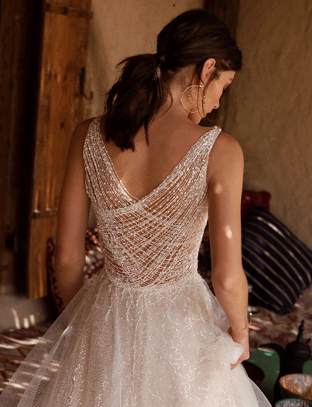 Wedding dresses with a ruched bodice for a textured lookV-Neck Sleeveless A-Line Wedding Gown with Playful Back Wedding dresses with a ruched bodice for a textured lookV-Neck Sleeveless A-Line Wedding Gown with Playful Back