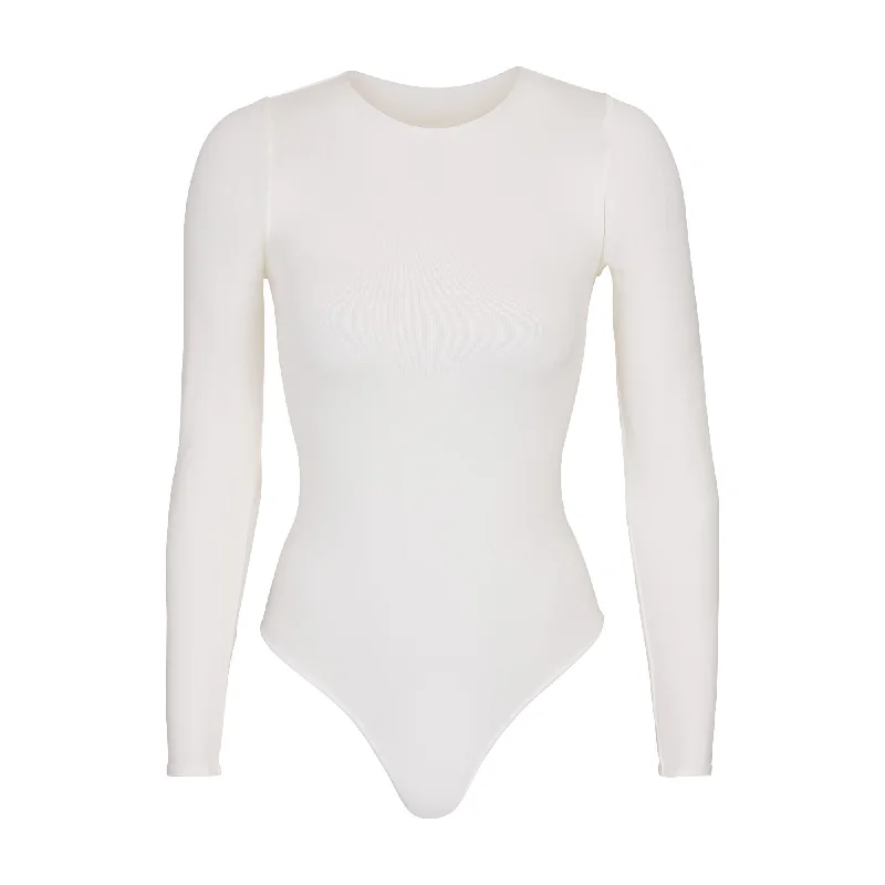 Ruffled Bodysuits with a Playful and Feminine TouchESSENTIAL CREW NECK LONG SLEEVE BODYSUIT | MARBLE Ruffled Bodysuits with a Playful and Feminine TouchESSENTIAL CREW NECK LONG SLEEVE BODYSUIT | MARBLE
